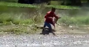 motorcyclist fights monkey